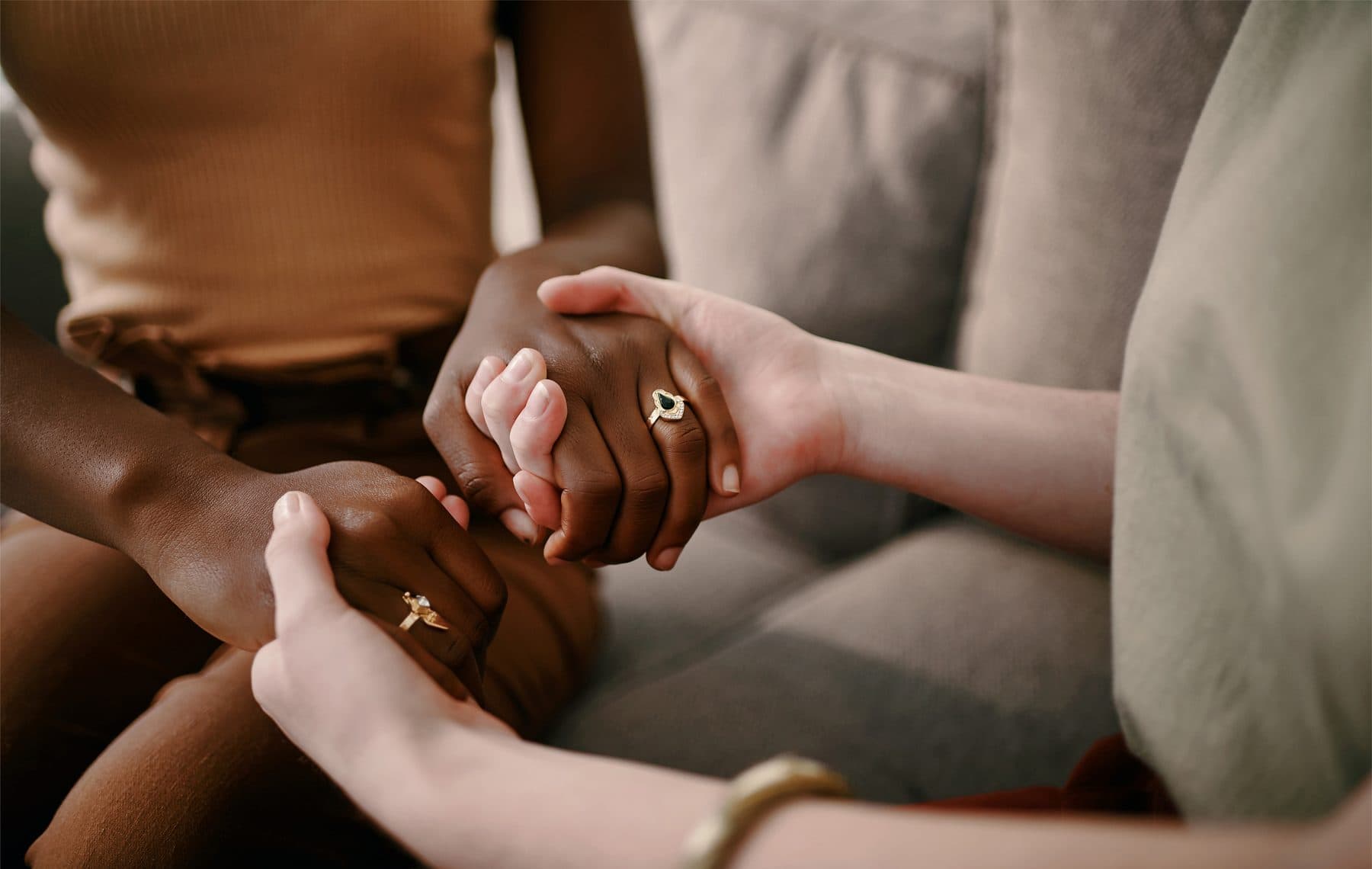 two people holding hands in support